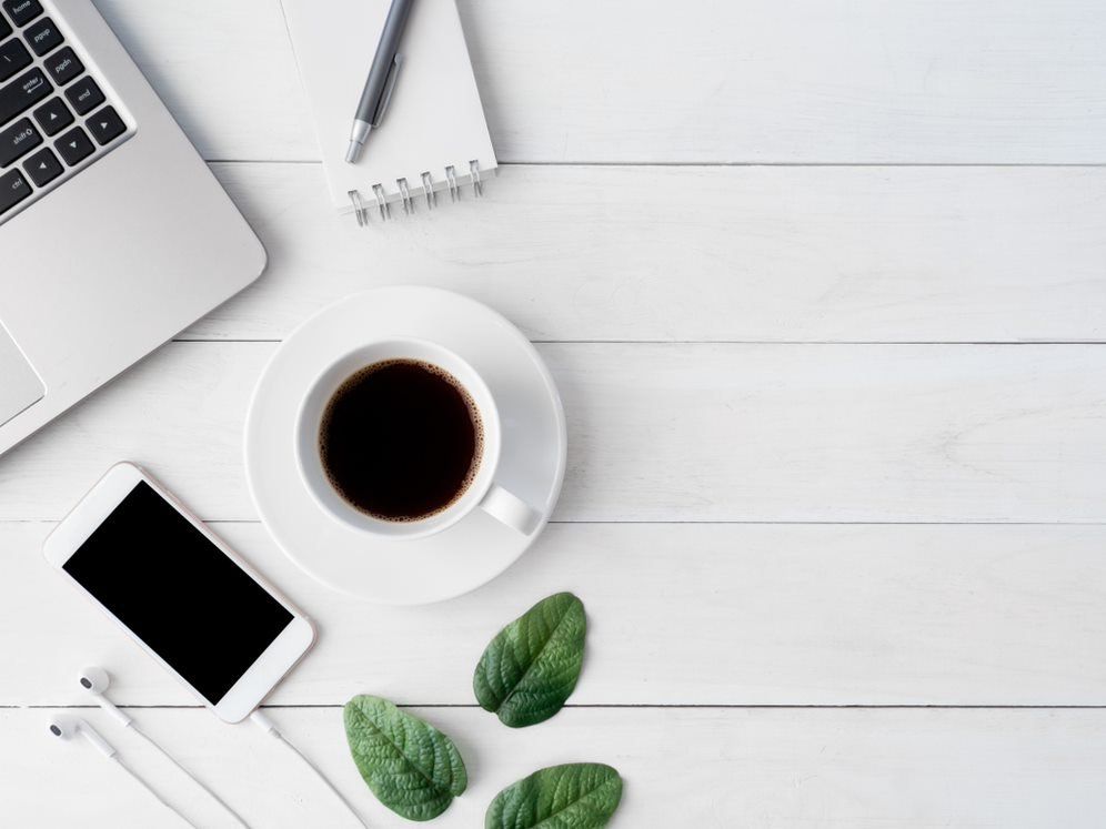 Computer, Phone, And Coffee In A Modern Office - Serviced Offices In Townsville, QLD