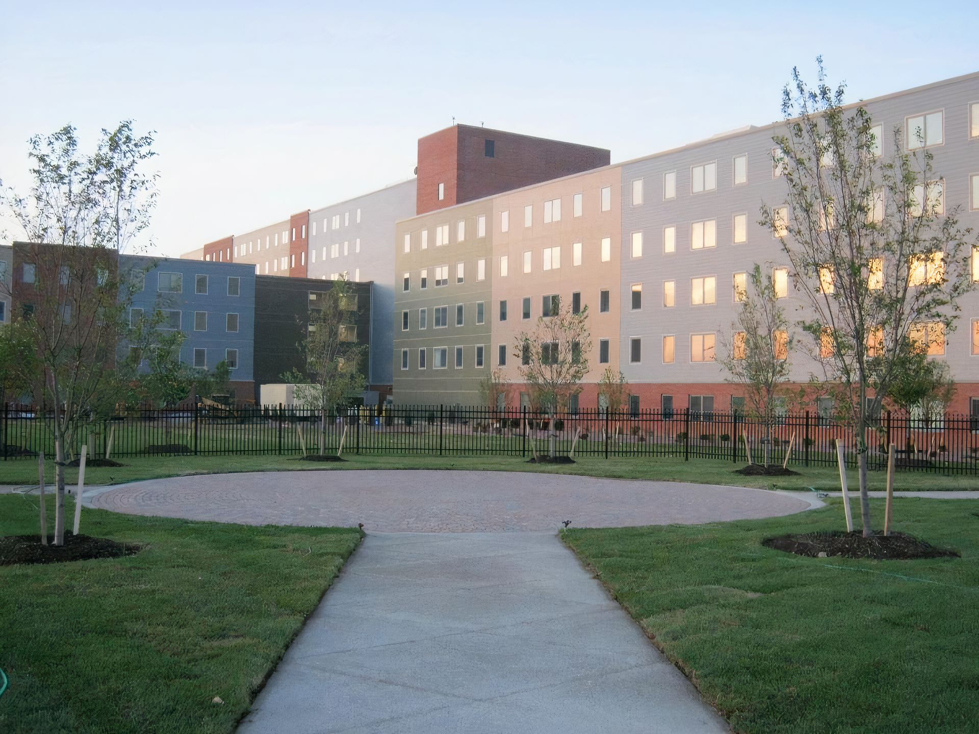 A large building with a few trees in front of it
