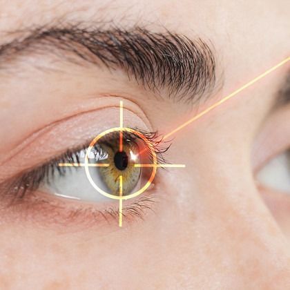 Close-up of an eye with a glowing iris overlay and targeting crosshair