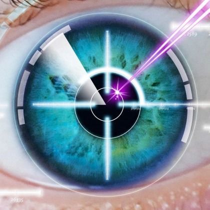 Close-up of a blue-green eye with a futuristic digital target overlay and purple laser beam