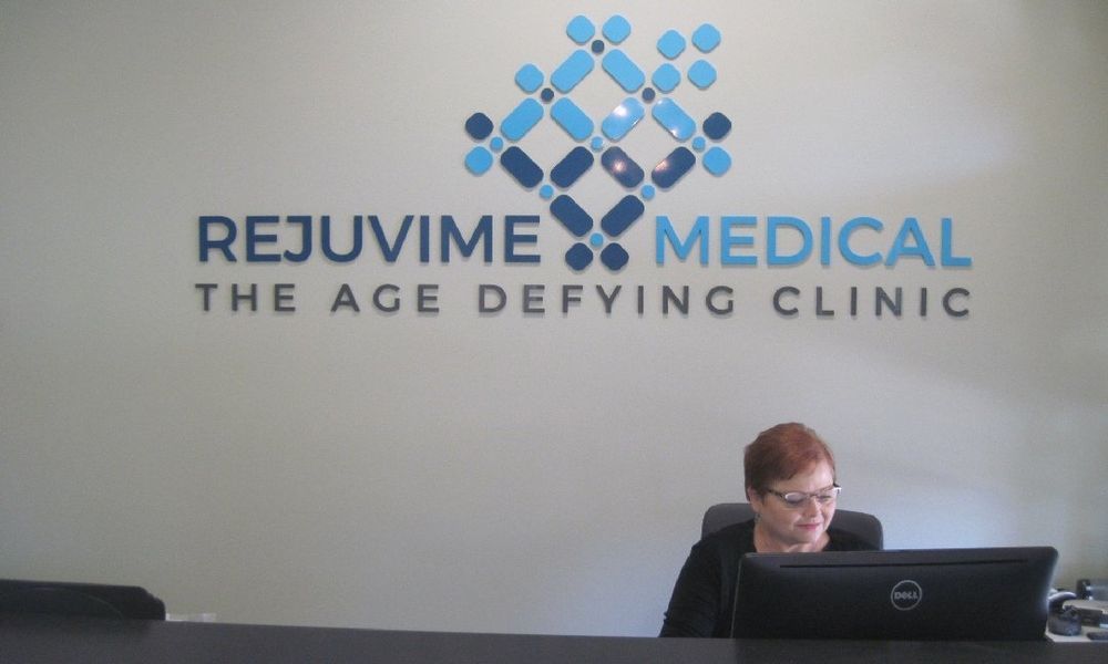 Reception area with woman at desk, 