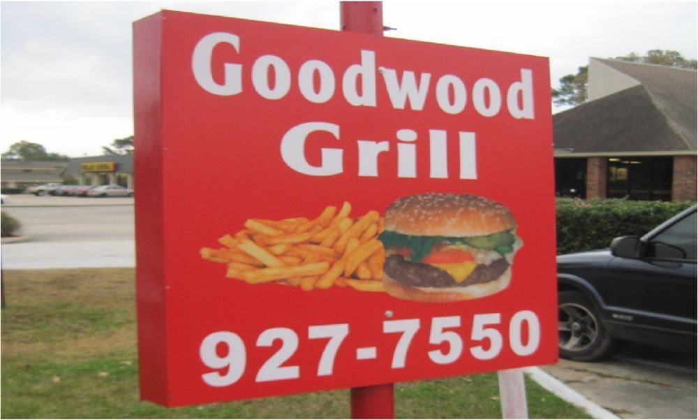 Red sign for Goodwood Grill with an image of a burger and fries. Phone number 927-7550 displayed.