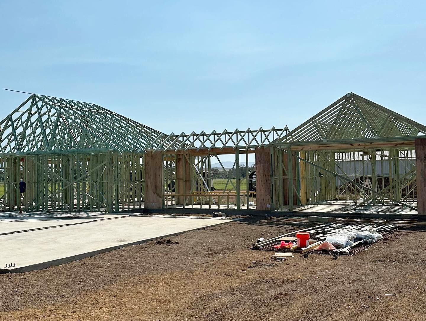 A Car is Parked in Front of a Building Under Construction  — Trussted Frames & Trusses In Taminda, NSW