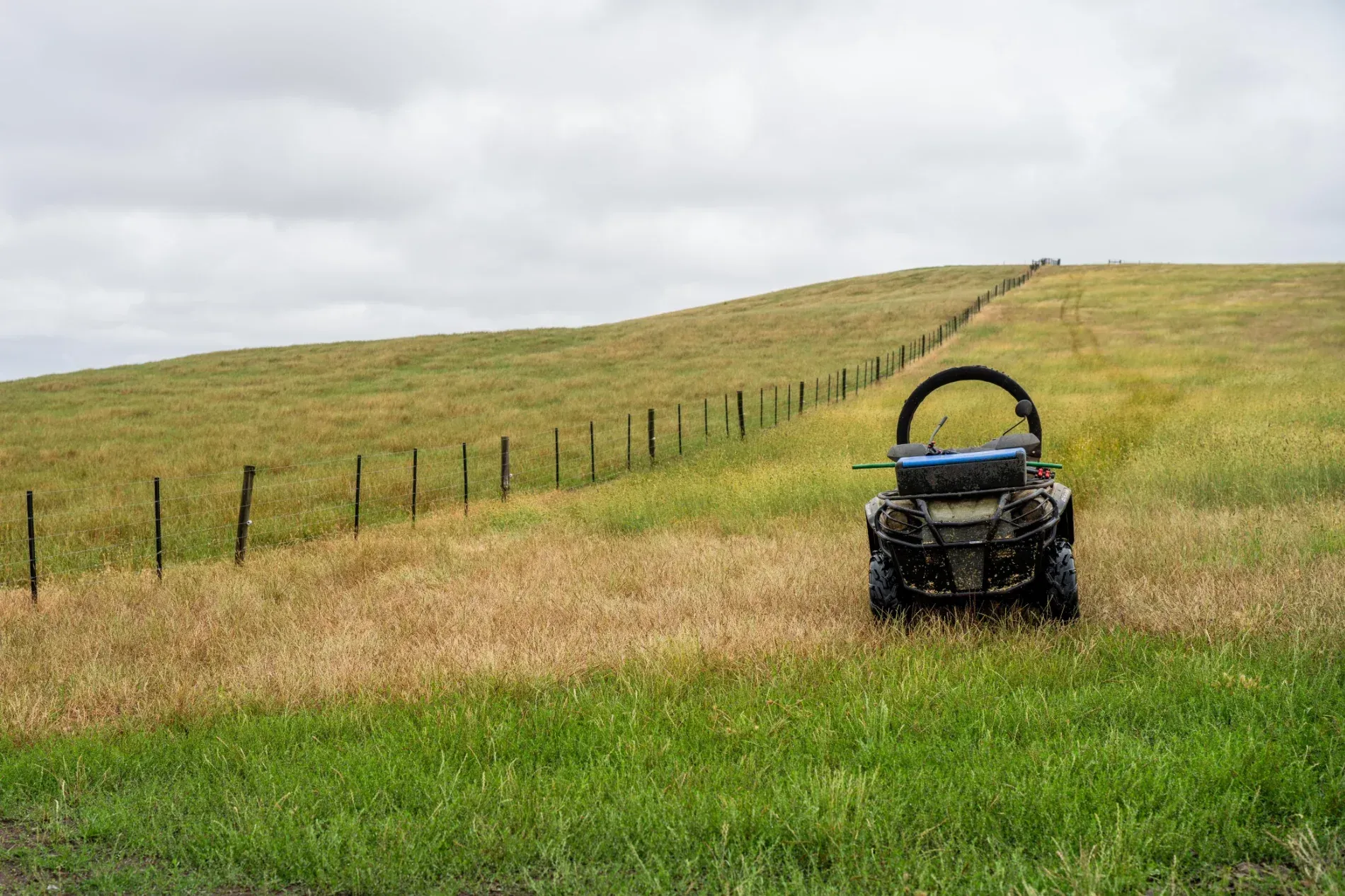Blue ATV On A Grassy Hillside — Jack Too You Mobile Servicing and Repairs In Goomboorian, QLD