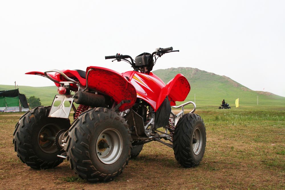 Atv Parked On Ground With A Small Hill In The Background — Jack Too You Mobile Servicing and Repairs In Sunshine Coast, QLD