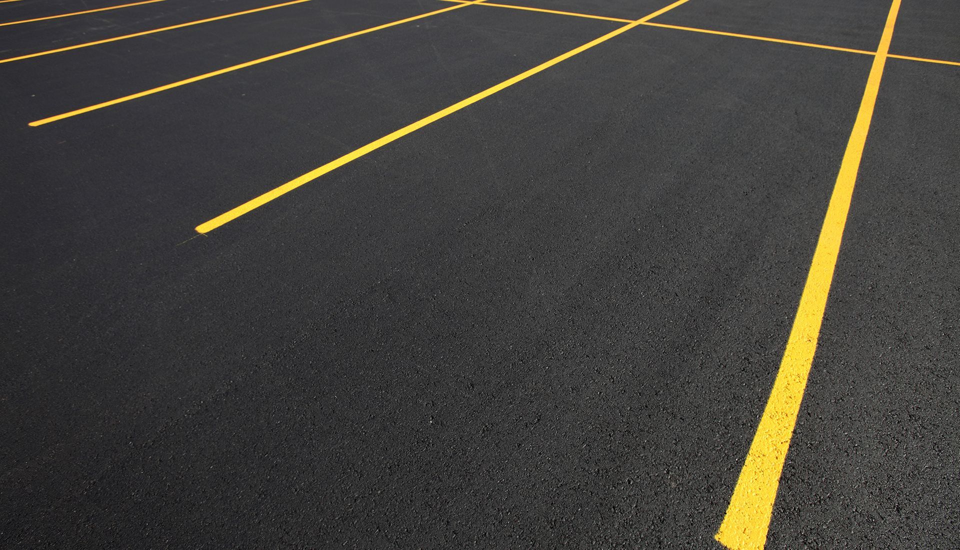 A parking lot with yellow lines on it