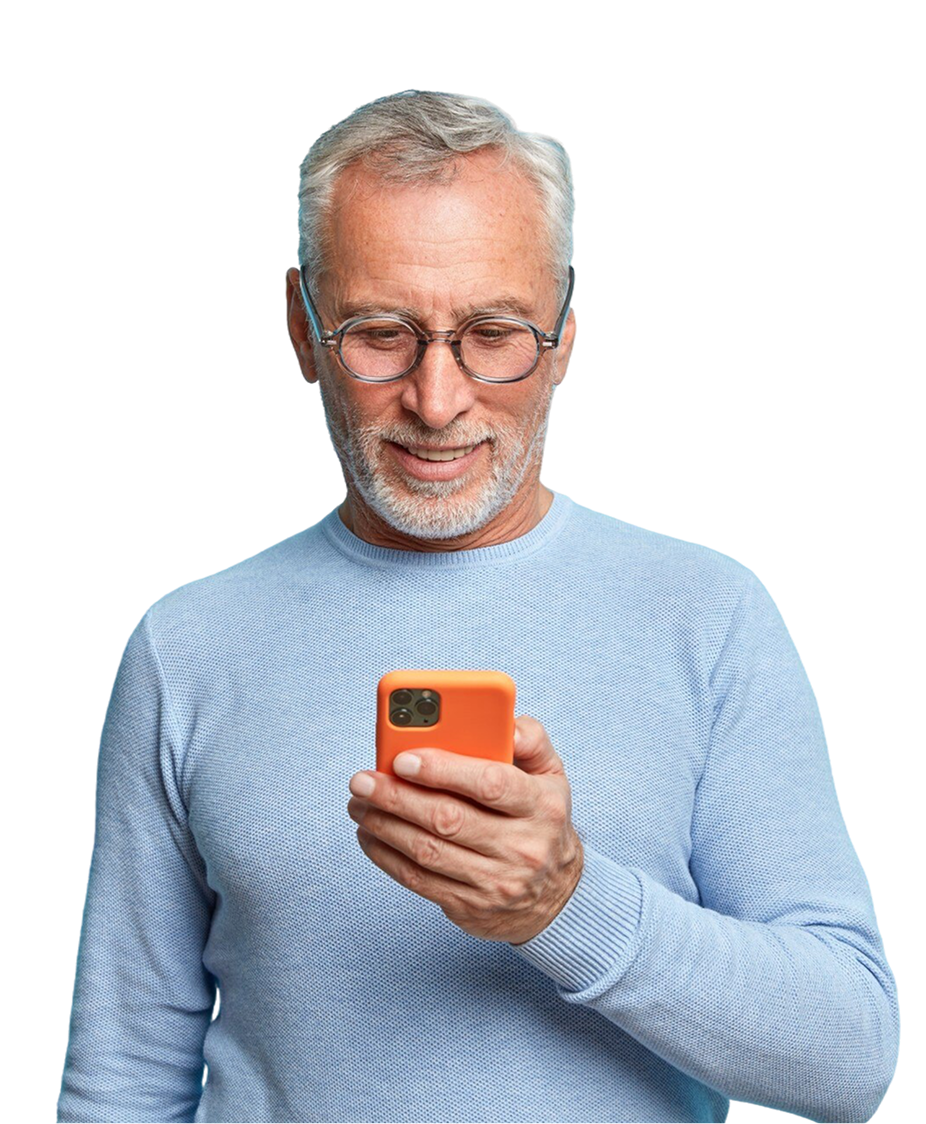 Man with gray hair and glasses looking at an orange phone, smiling.