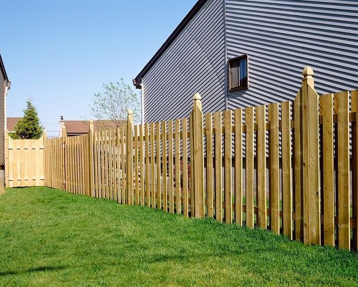 A wooden deck between two houses in a backyard in Belleville.