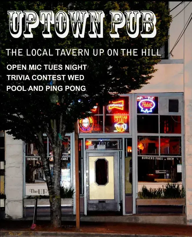 Uptown Pub storefront with neon signs and text advertising live music, trivia, and pool and ping pong