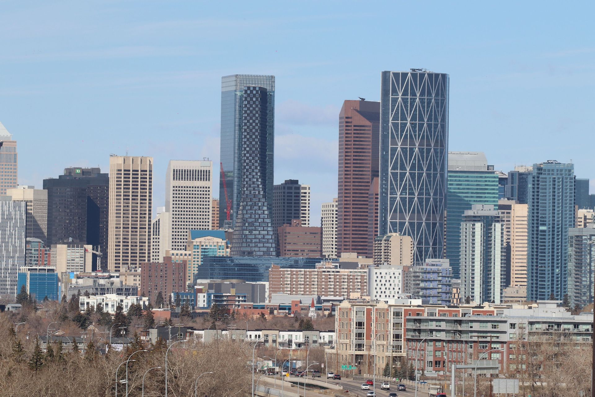 City skyline with modern high-rise buildings under a clear blue sky