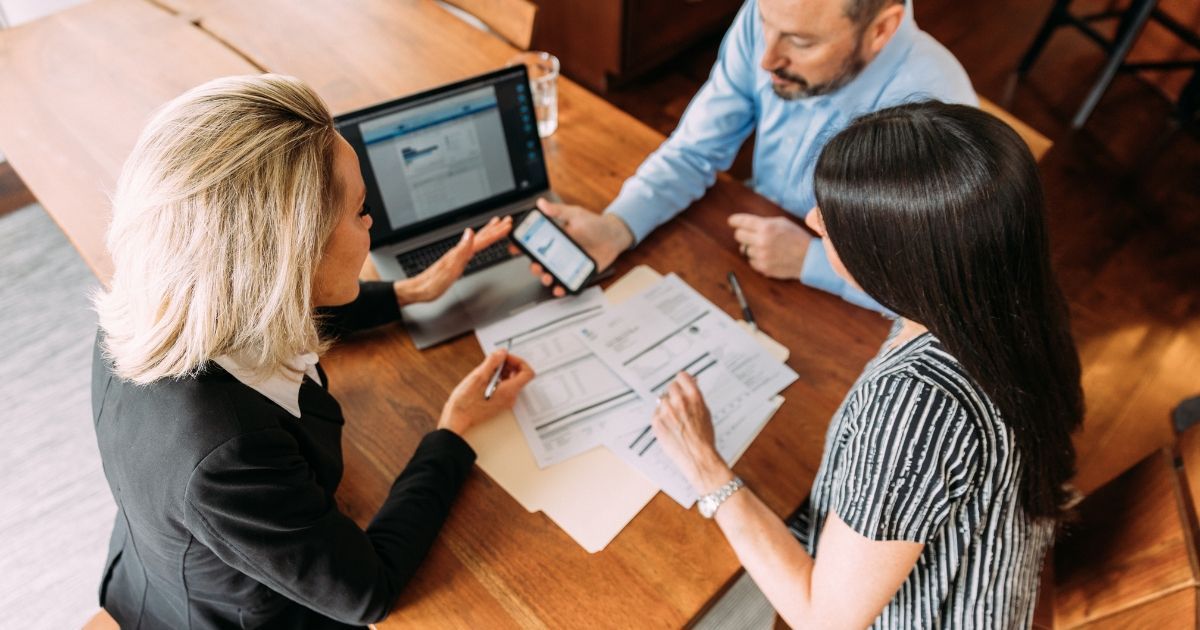 couple working with a financial advisor