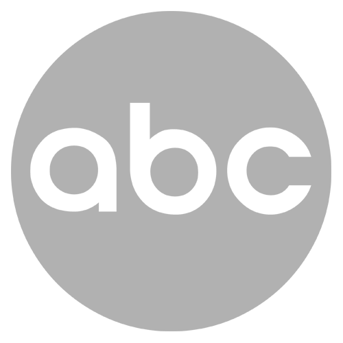 ABC logo in white letters inside a gray circle.