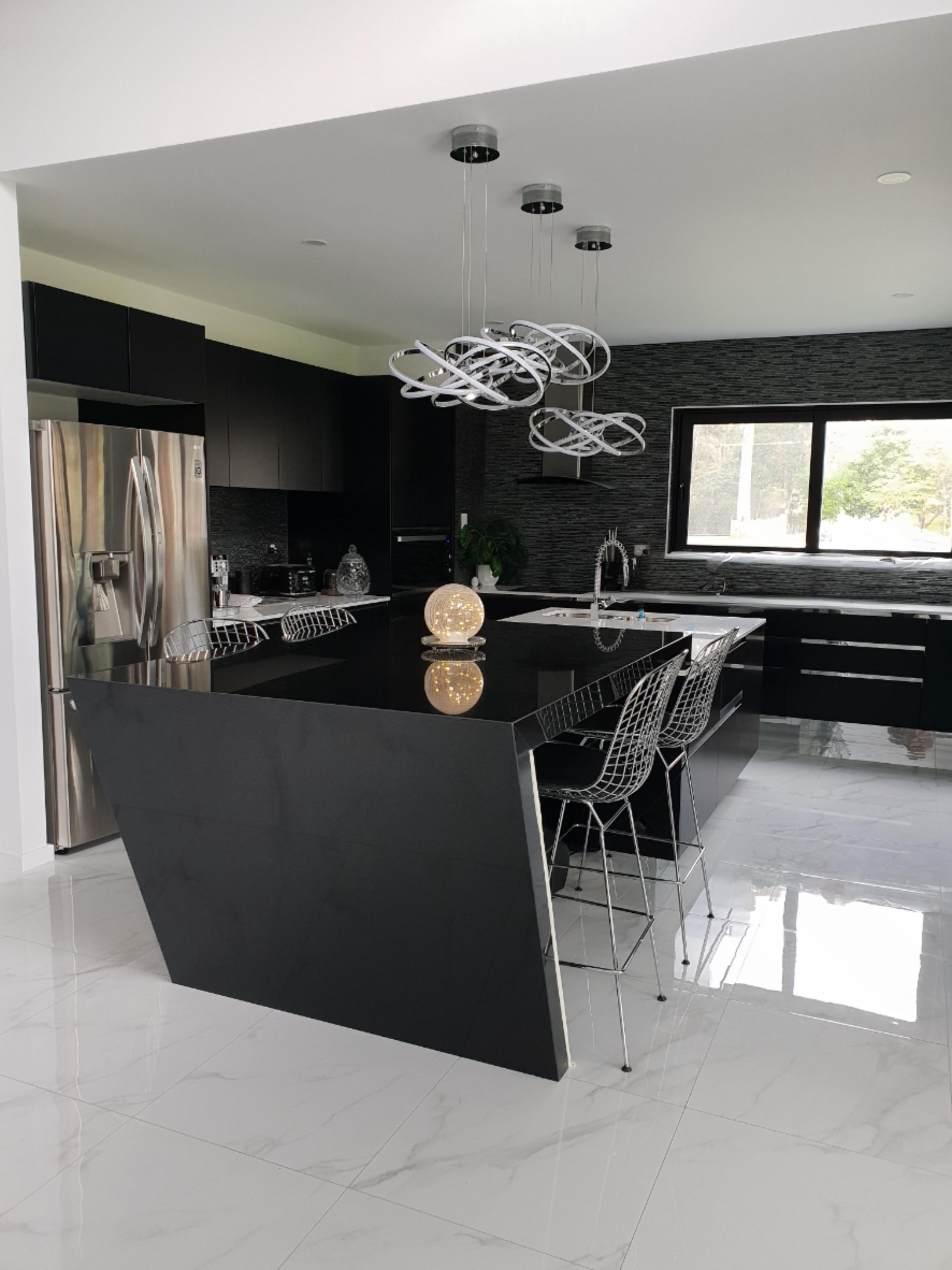 Sleek Modern Kitchen With Black Cabinets, Island, and Countertops — Gateway Manufacturing in Gosford, NSW