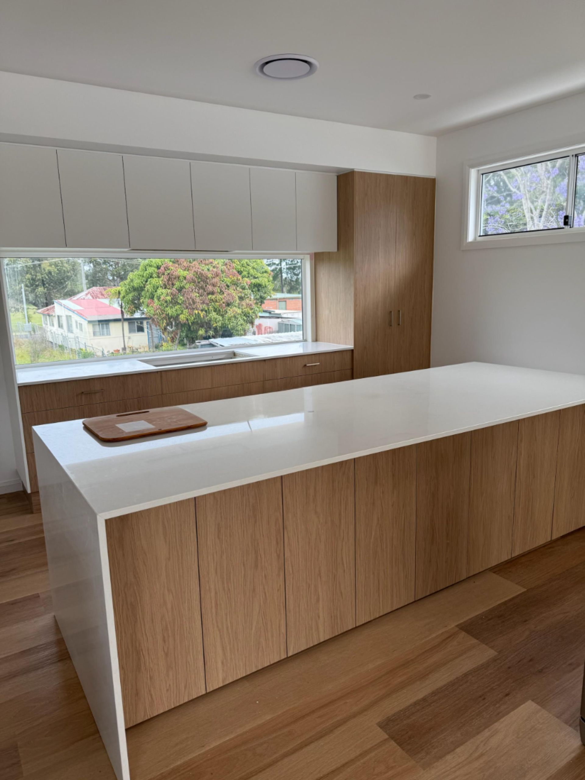 Modern Kitchen With Wooden Cabinets and Island, White Countertops — Gateway Manufacturing in Maitland, NSW