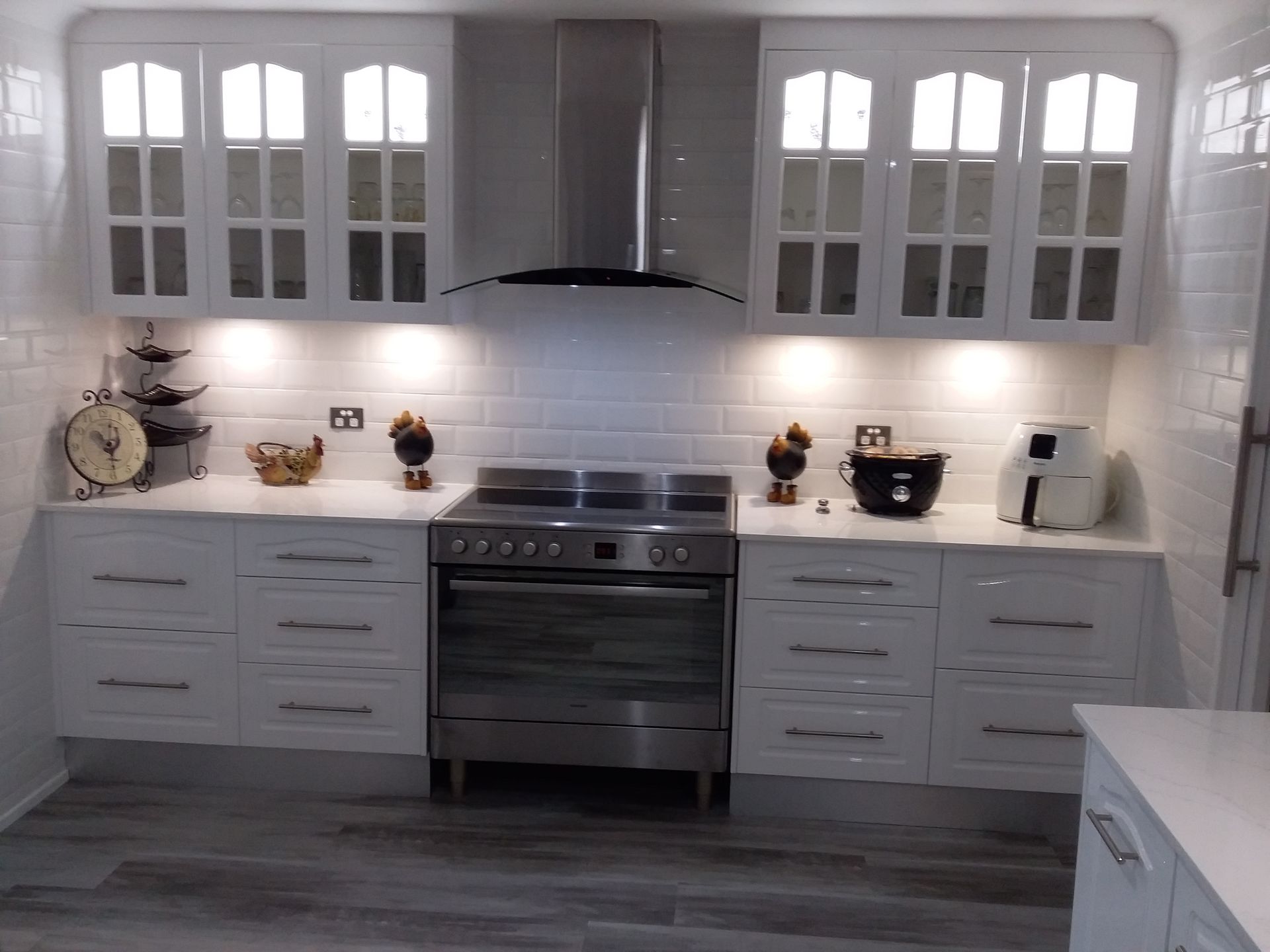 White Kitchen With Stainless Steel Appliances Overhead Cabinets — Gateway Manufacturing in Lake Macquarie, NSW