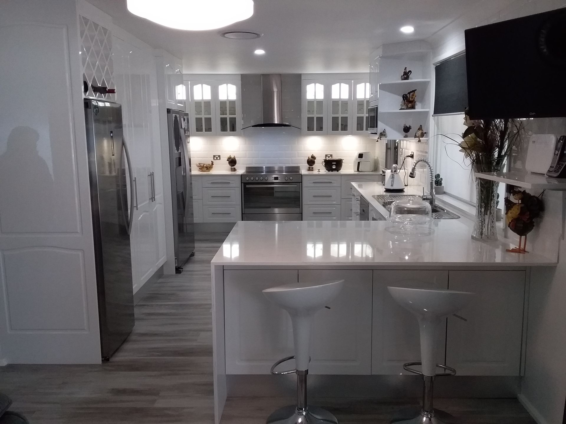 White Modern Kitchen With Island Seating, Stainless Steel Appliances — Gateway Manufacturing in Port Stephens, NSW