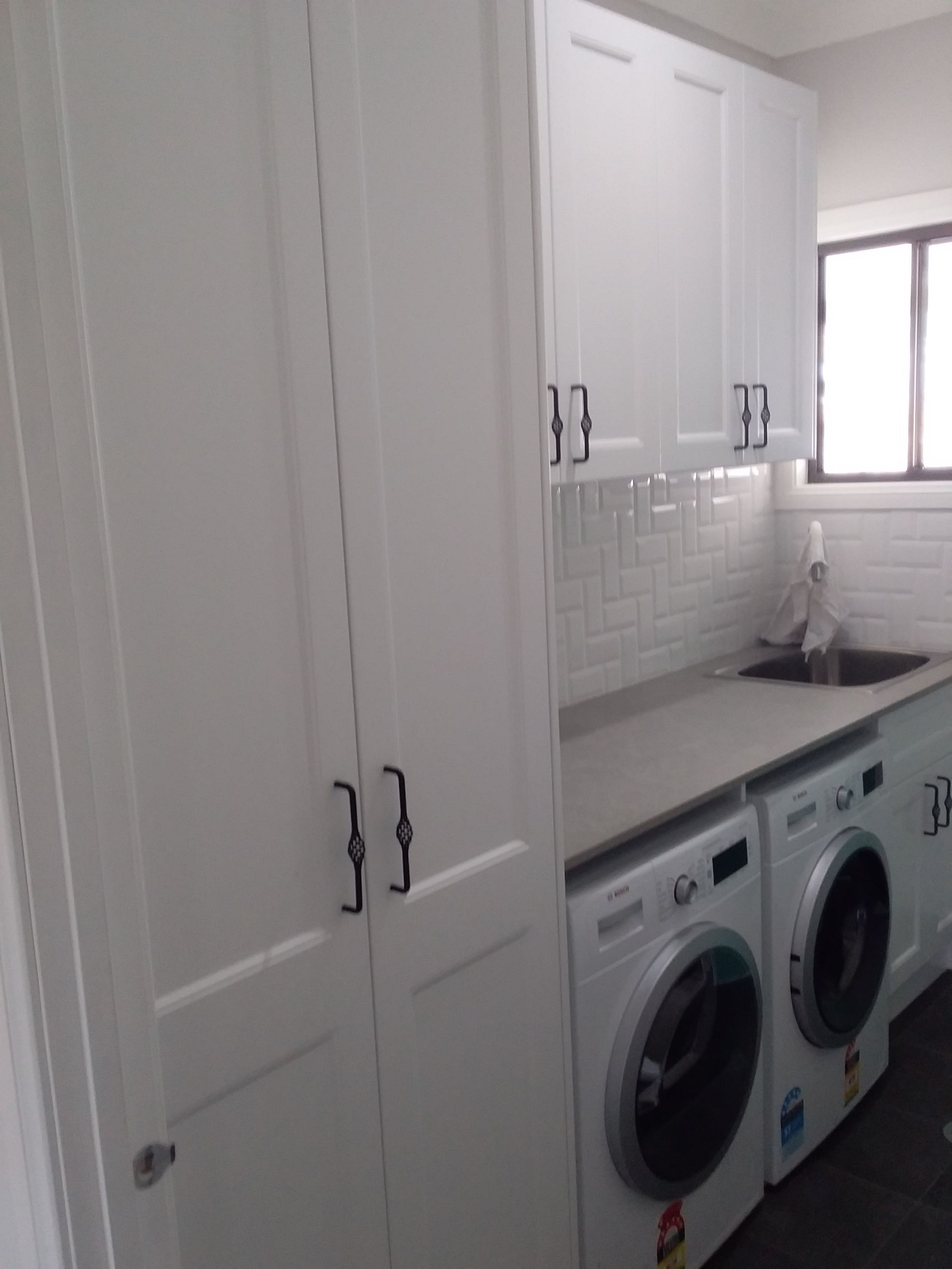 White Laundry Room With Cabinets, Washing Machines, and Sink — Gateway Manufacturing in Maitland, NSW