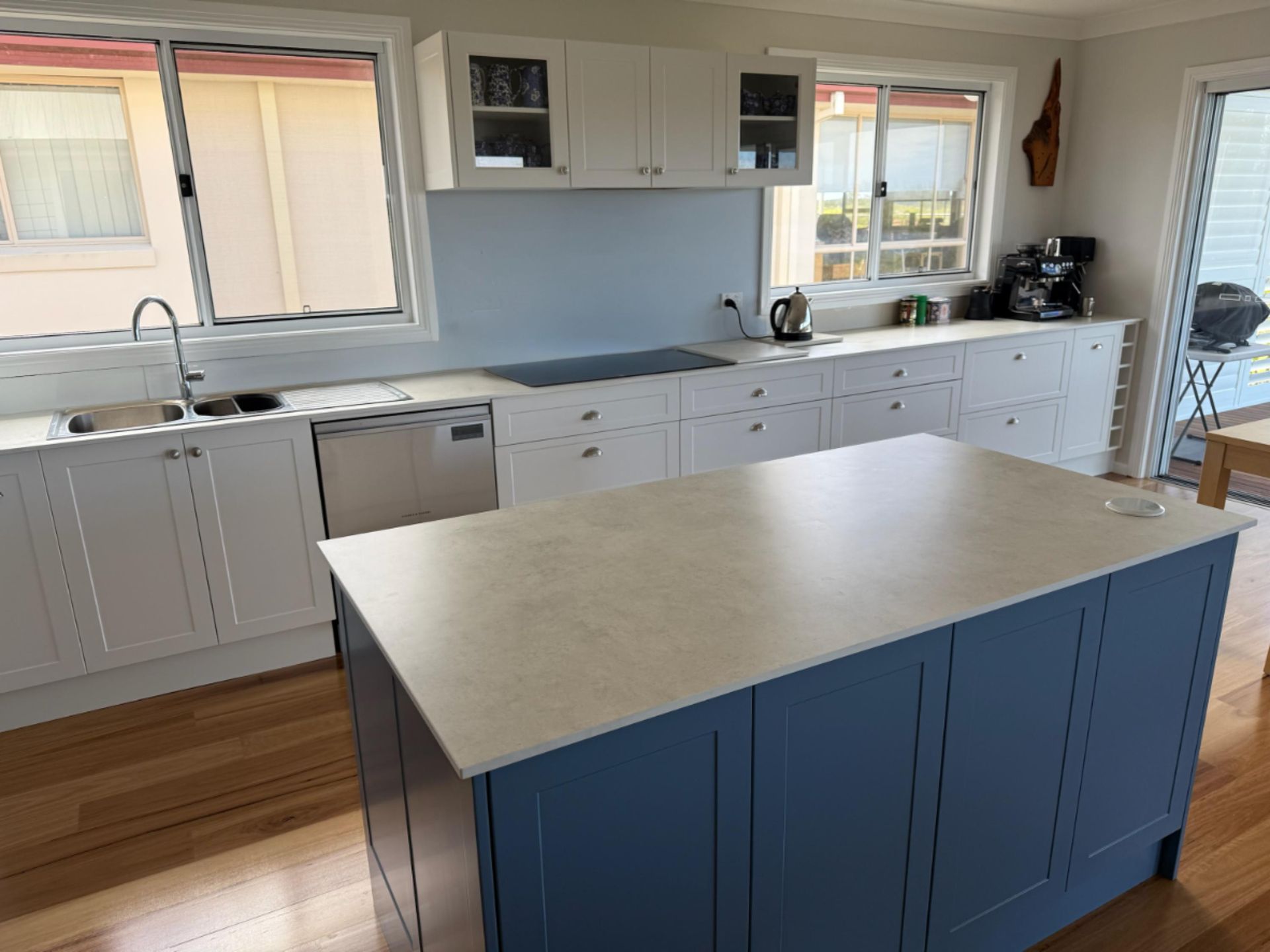 Blue and White Kitchen With an Island, Hardwood Floors, and White Countertops — Gateway Manufacturing in Port Stephens, NSW