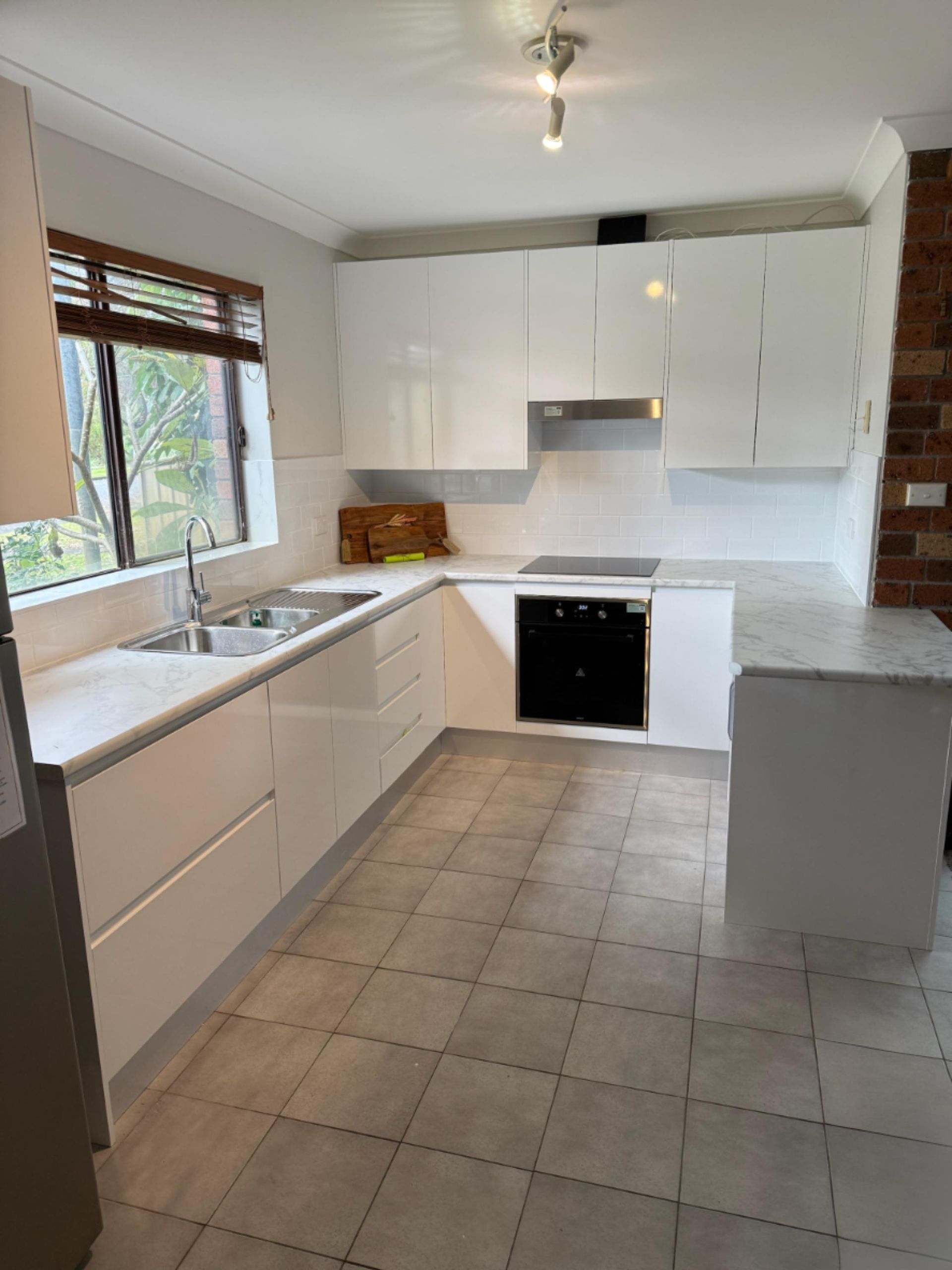 White Modern Kitchen With Cabinets, Sink, and Oven — Gateway Manufacturing in Cessnock, NSW