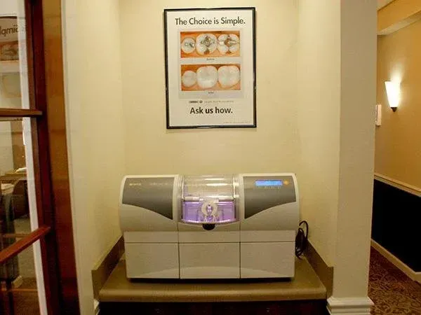 A machine is sitting on a counter under a sign that says the choice is simple