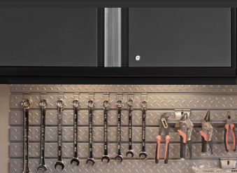 Industrial workshop with metal cabinets, tools, and shelves of cleaning supplies
