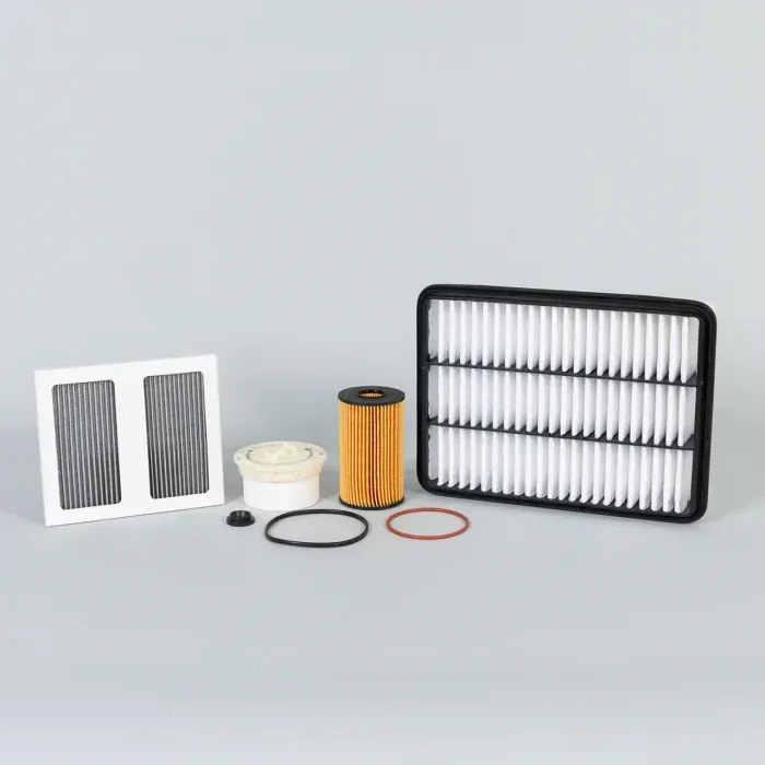 Assorted air filters and replacement filter parts on a gray surface