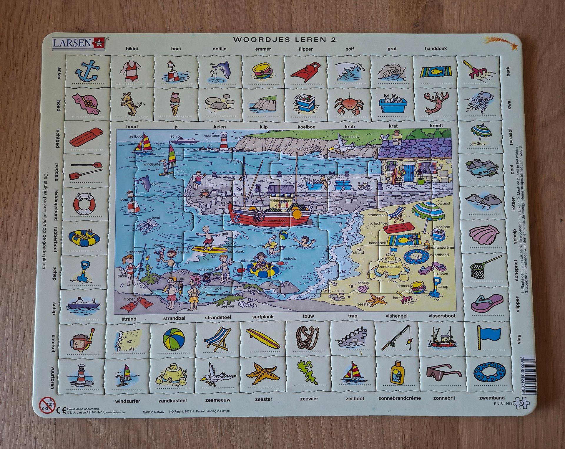 Larsen woordjes leren 2 puzzel - 70 stukjes. Thema: kunstlandschap/strand.