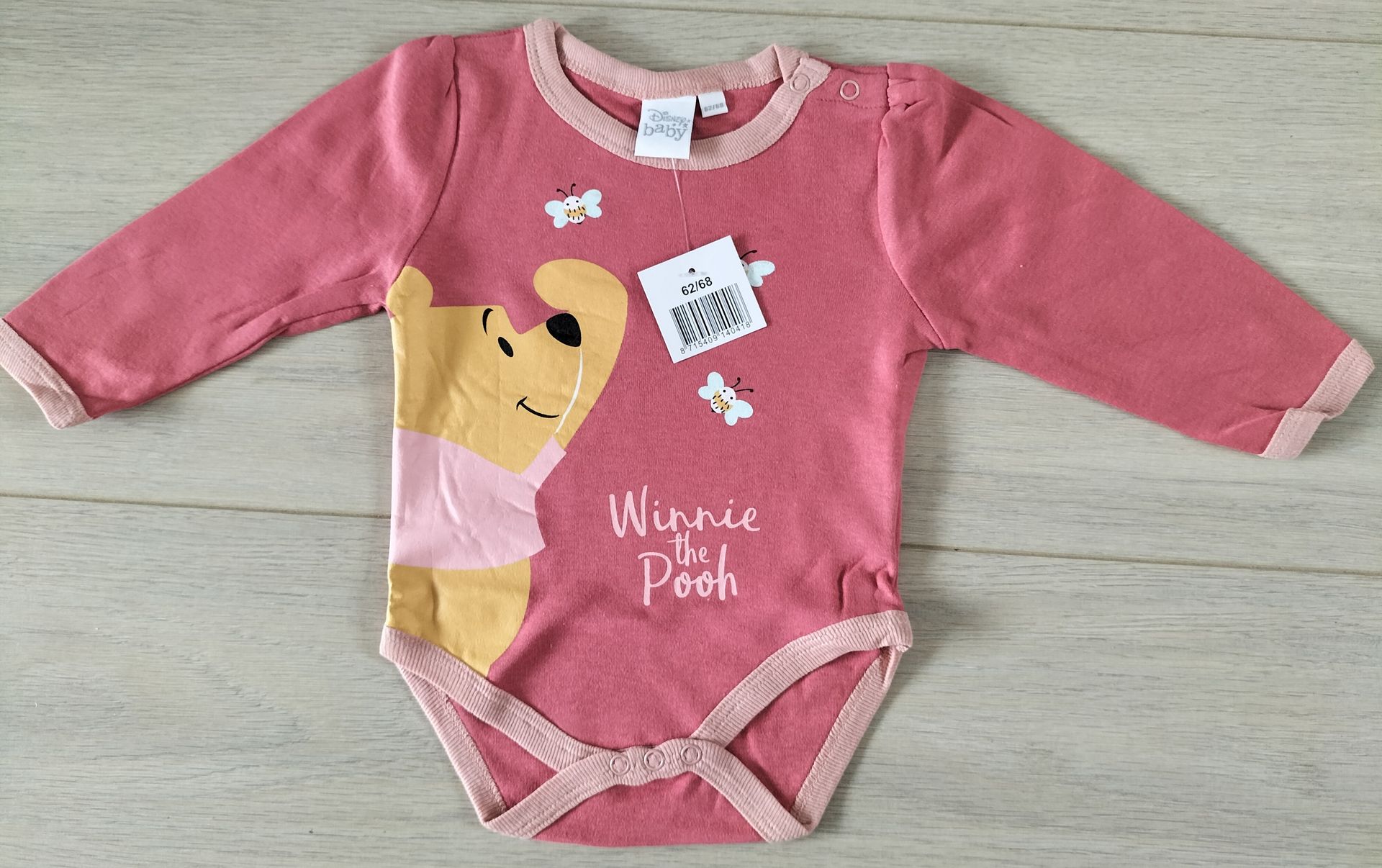 Roze Disney Winnie de Pooh romper. Maat 62 -68.