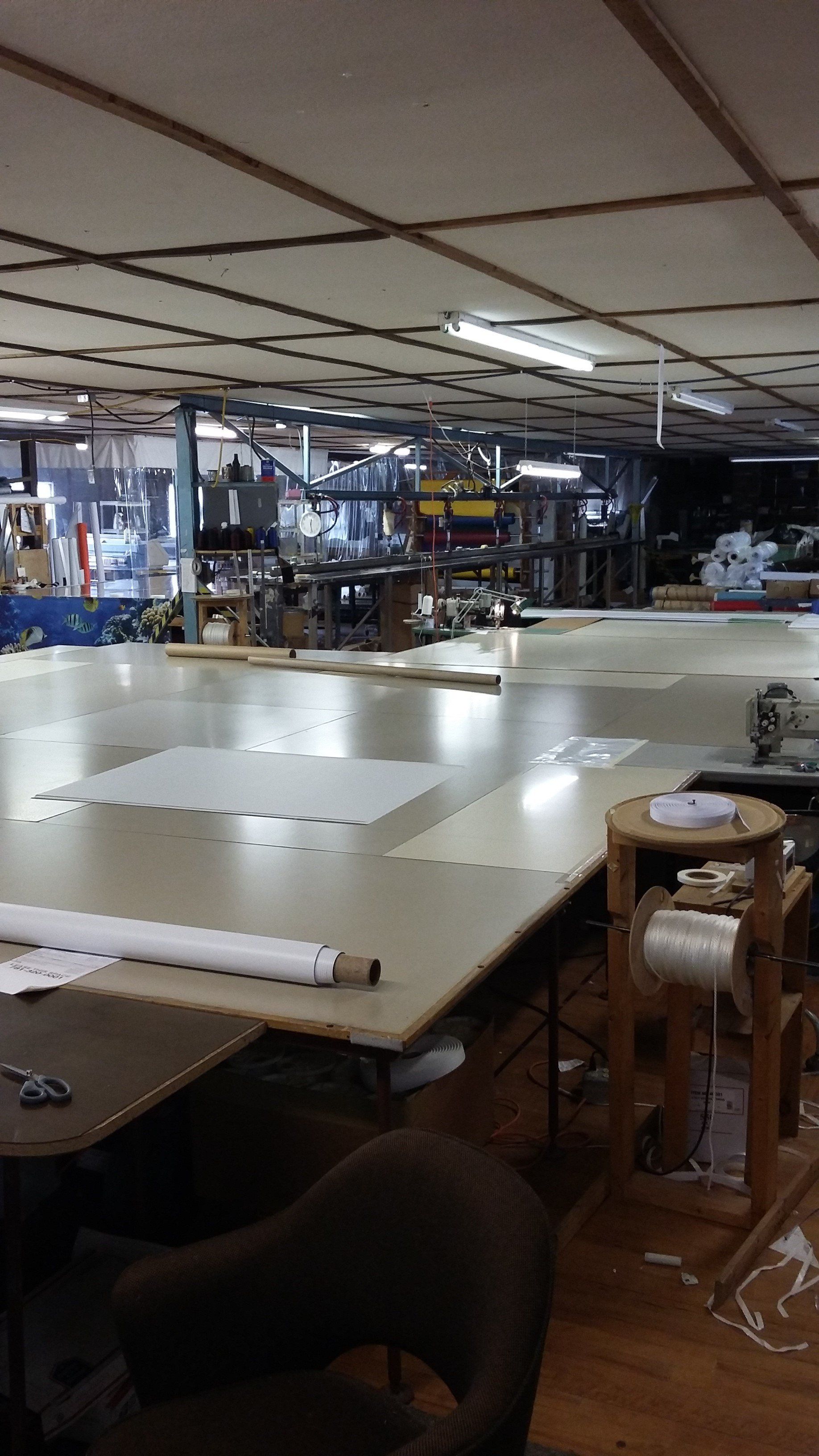 A large room with lots of tables and chairs in it