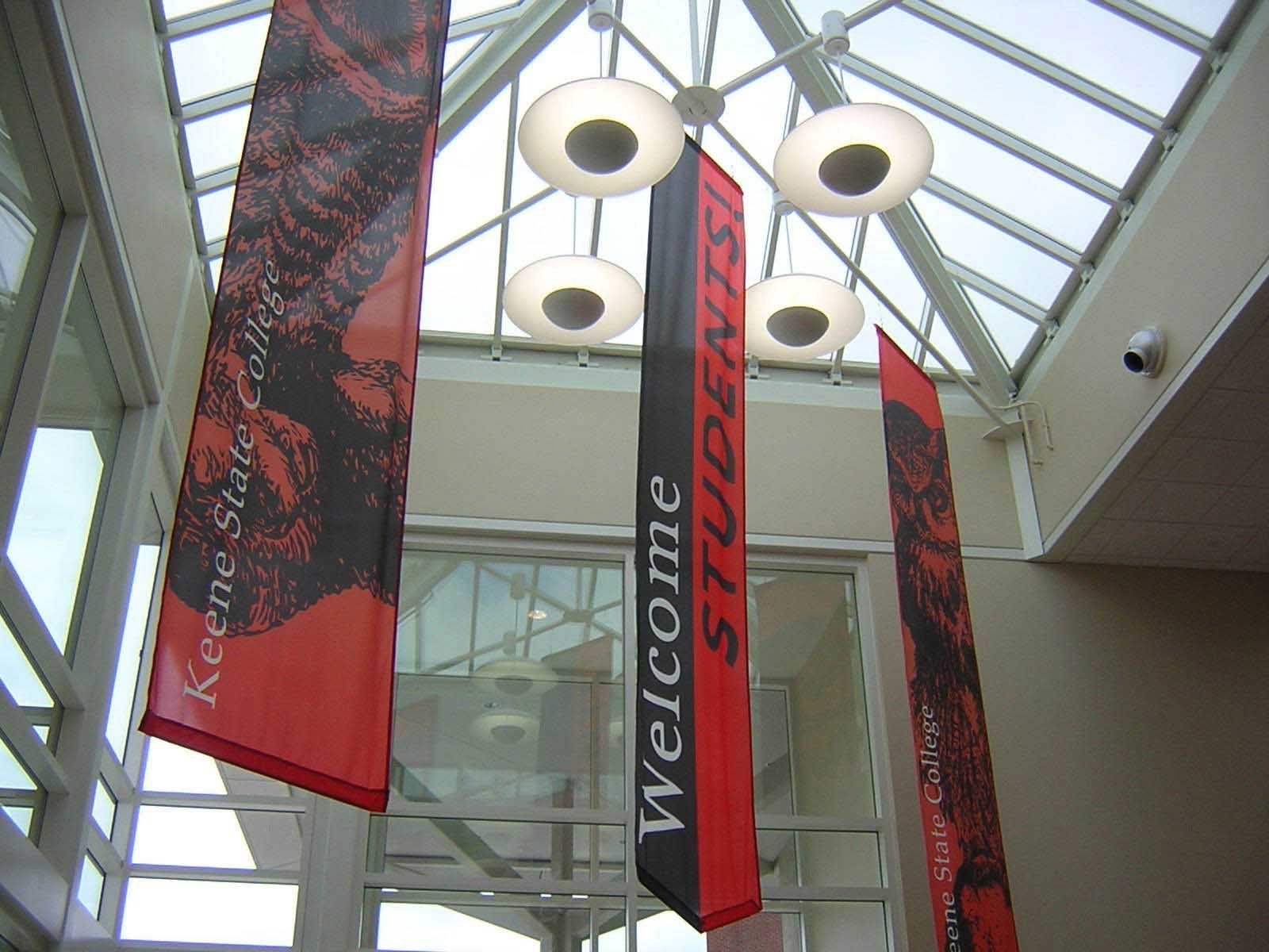 A welcome students banner hangs from the ceiling of a building