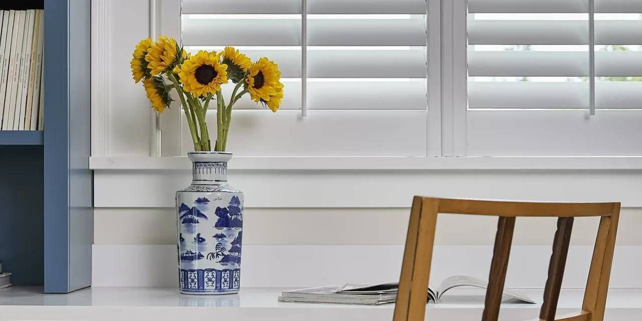 Hunter Douglas NewStyle® Composite Shutters Above a Desk near Newport News, Virginia (VA)