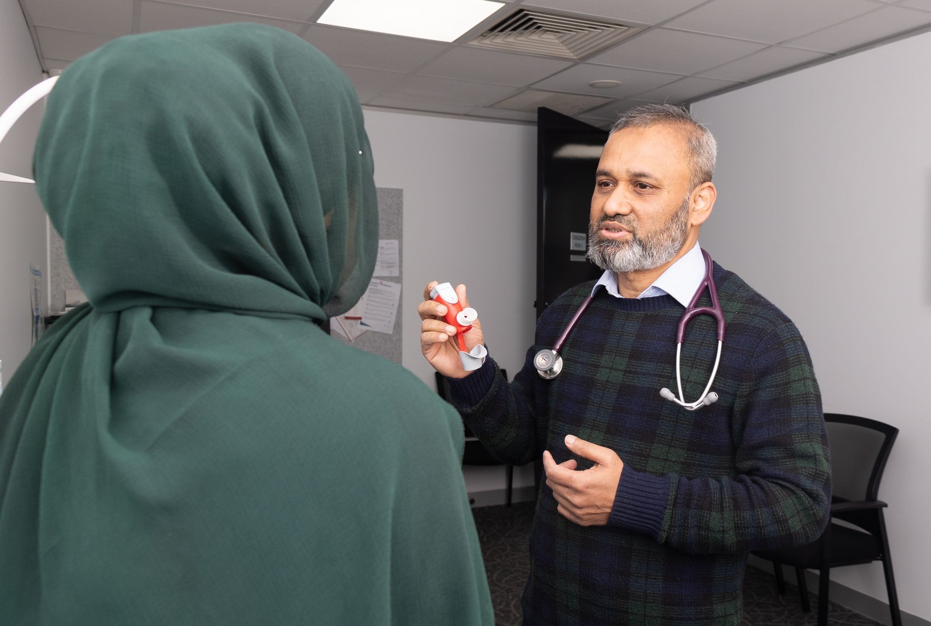 Dr Mohammad Rahman with a patient.