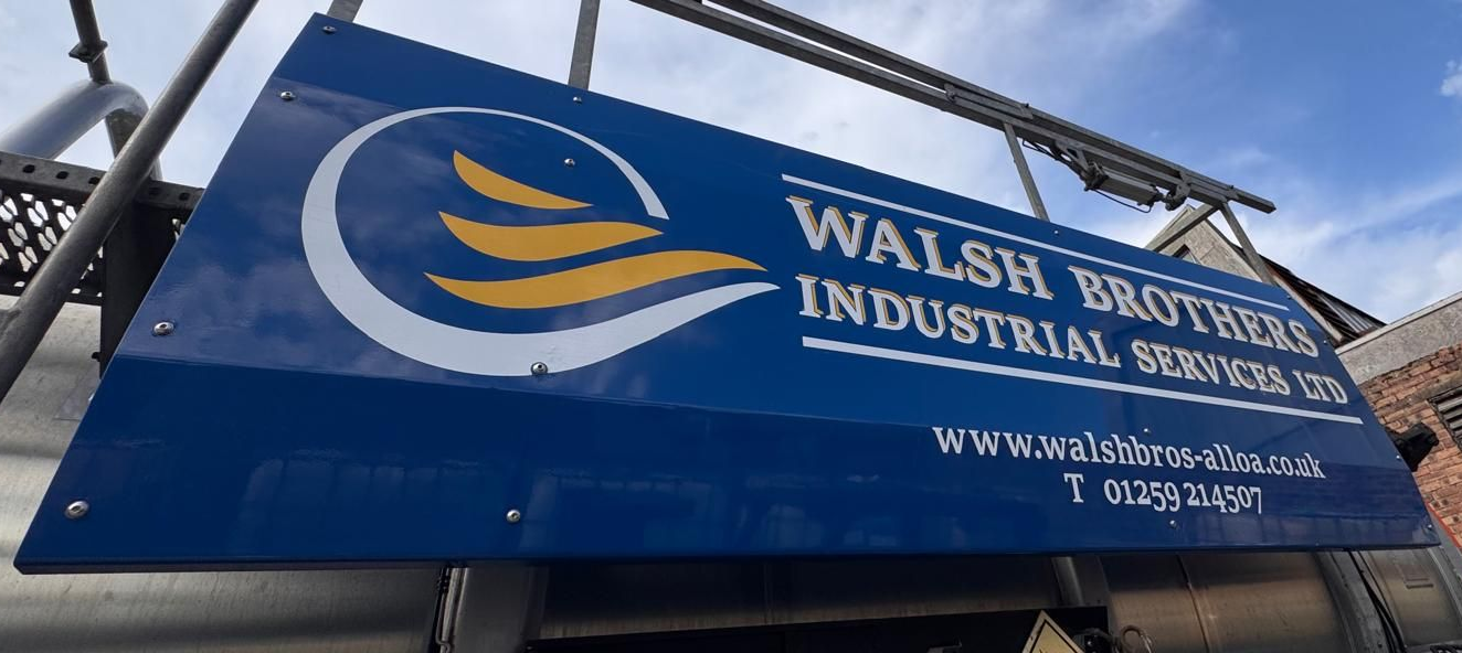 Blue sign for Walsh Brothers Industrial Services Ltd. with a white and yellow logo.