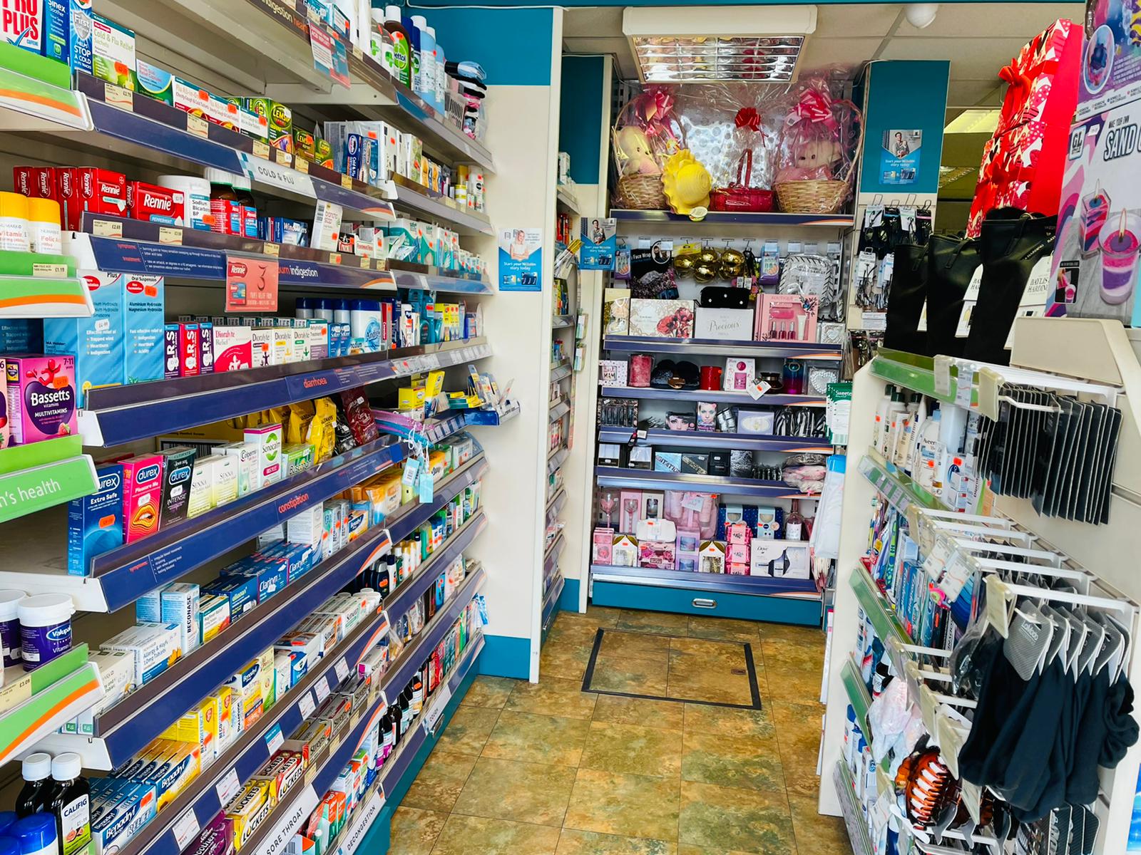 Shelves in Ramzy's Pharmacy displaying a wide range of personal care and beauty products