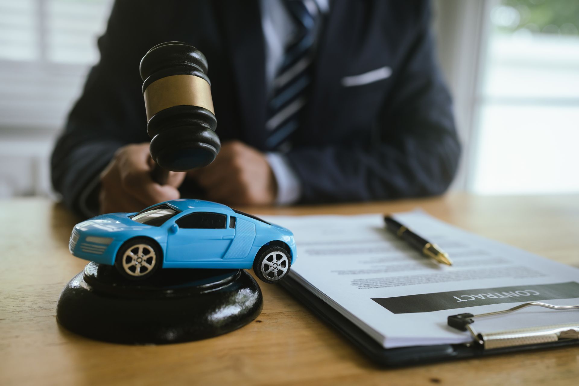 Auto accident attorney reviewing car crash claim documents.