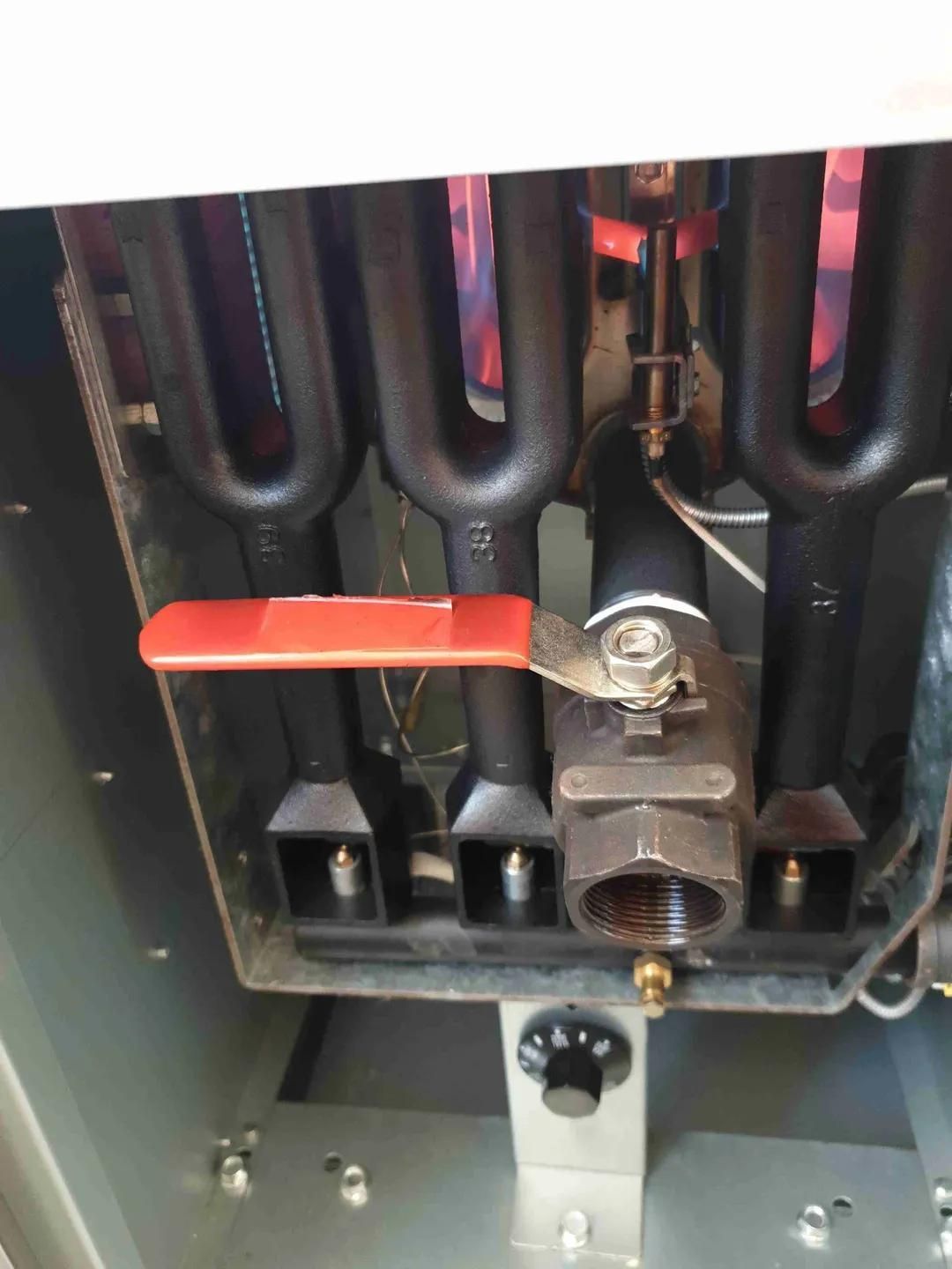 A Close up Of a Valve on A Stove with A Red Handle — Murwillumbah District Plumbing Service in Nunderi, NSW