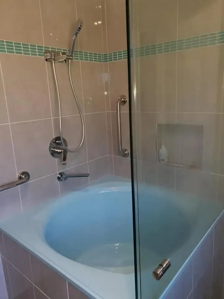 A Bathroom with A Bathtub and A Shower Stall — Murwillumbah District Plumbing Service in Kingscliff, NSW