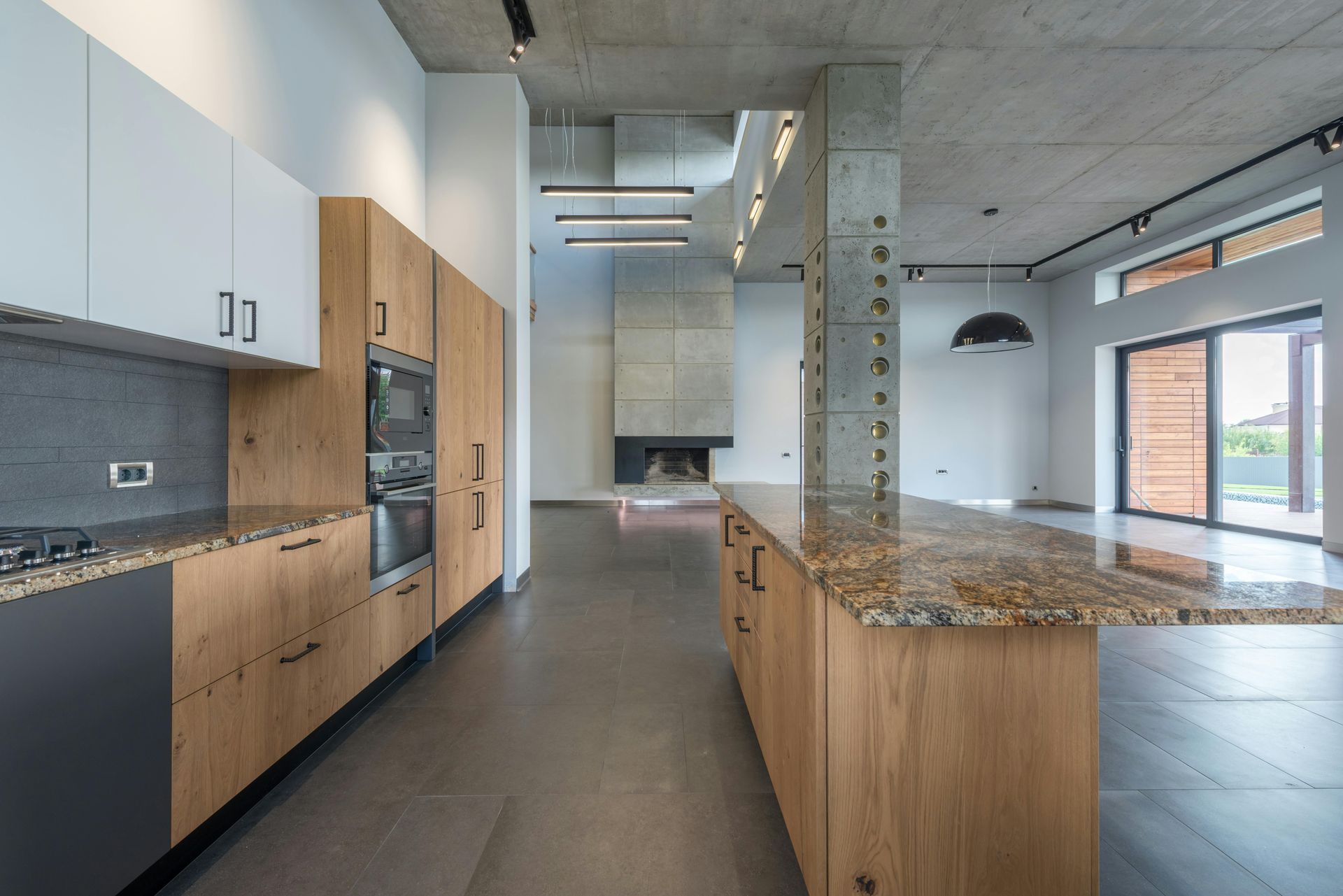 A kitchen with wooden cabinets and granite counter tops
