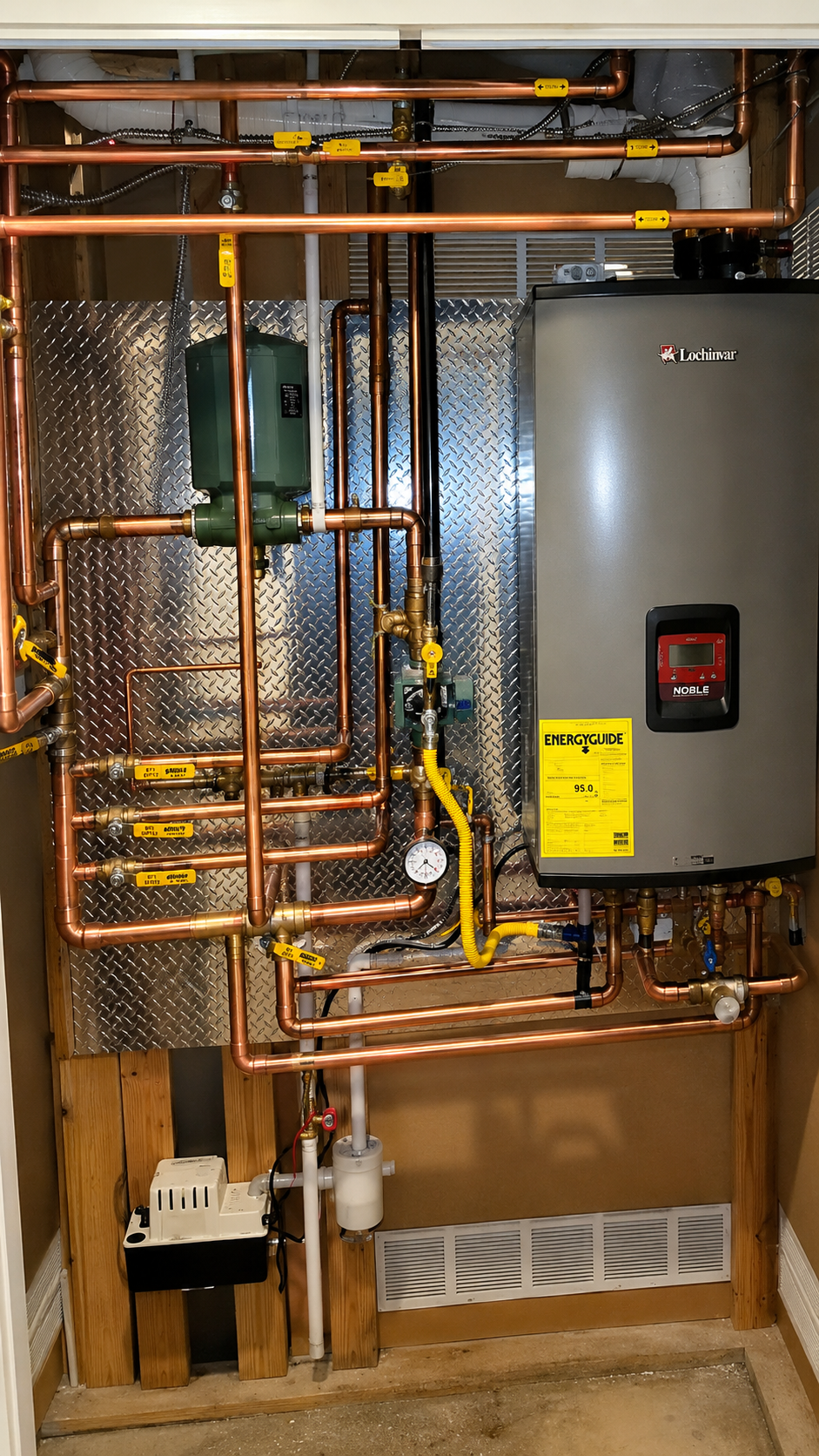 Utility room with exposed copper pipes, insulation, and a gray water heater on the right.