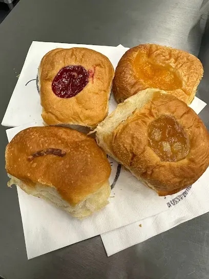 A bunch of pastries are on a napkin on a table