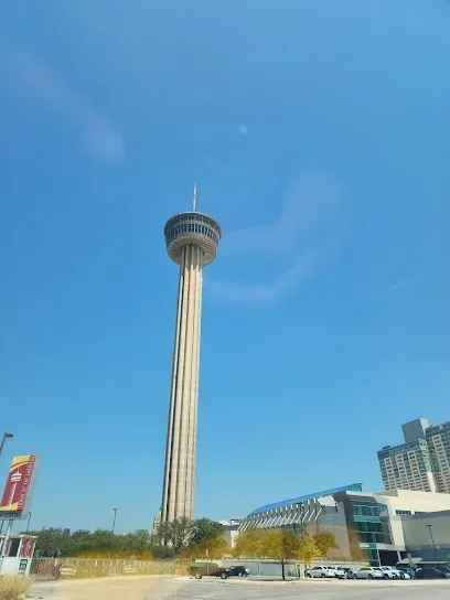 A tall tower with a blue sky in the background