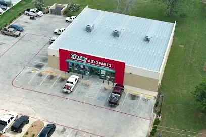 An aerial view of a store with cars parked in front of it.