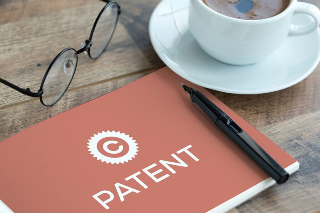 A patent book on a desk representing manufacturing patent protection