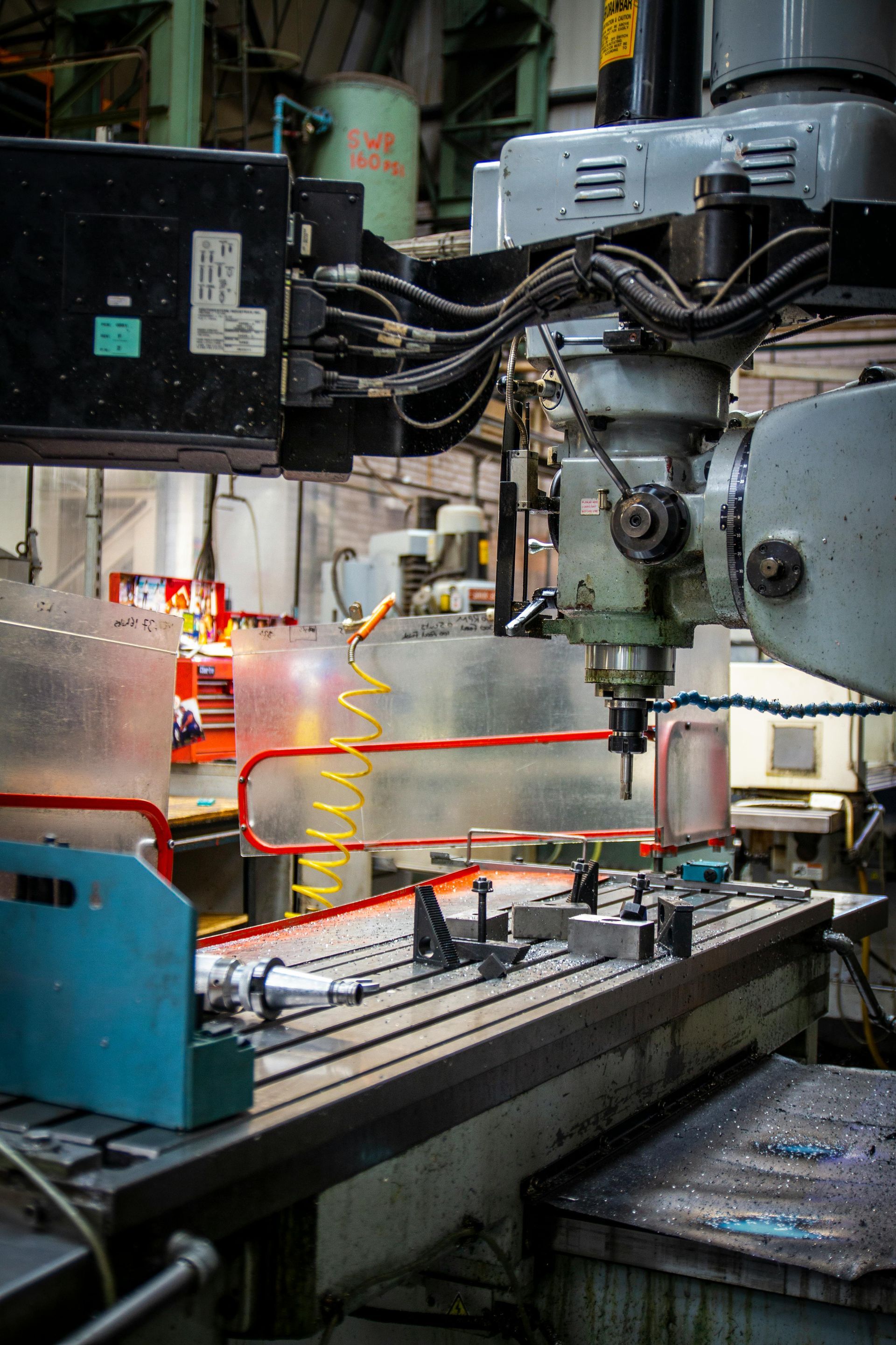 An industrial milling machine on a factory floor