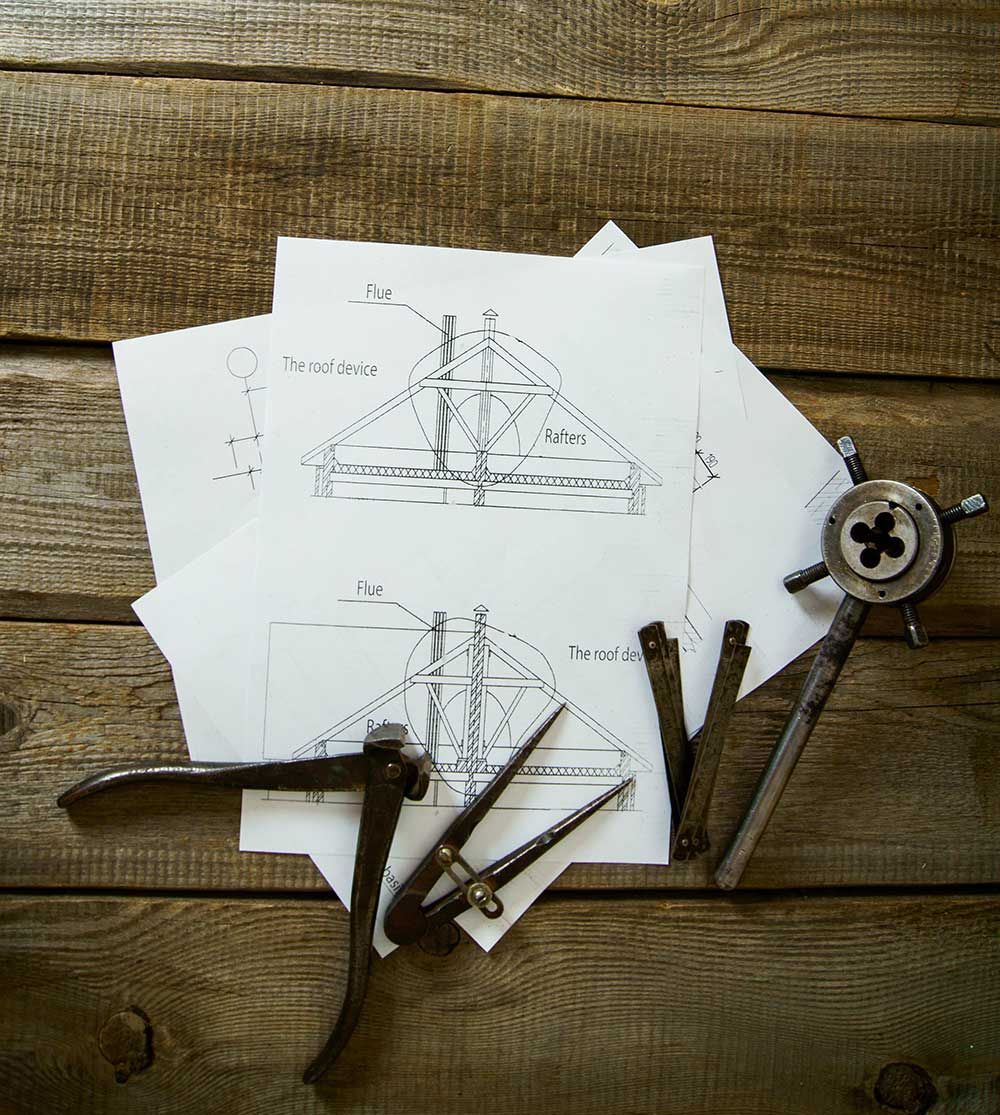 Technical drawings and drafting tools representing a provisional patent application