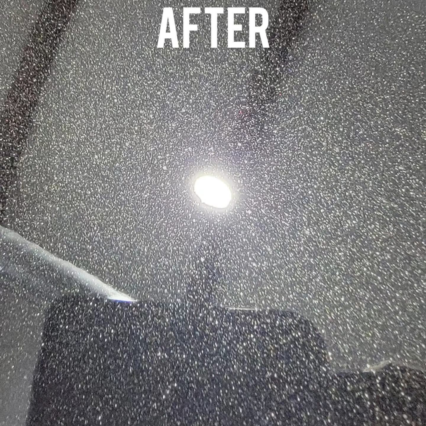 Close-up of a sparkling, dark surface reflecting a bright light, labeled