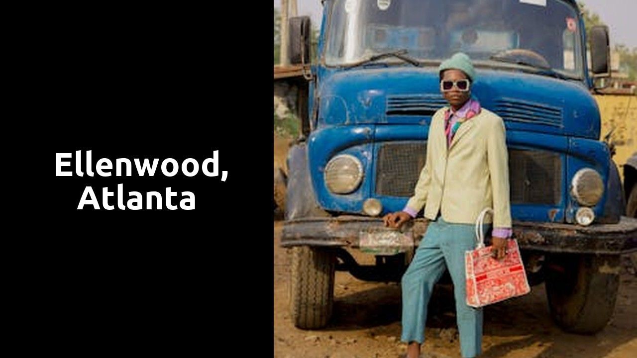 A man in a suit is standing in front of a blue truck.