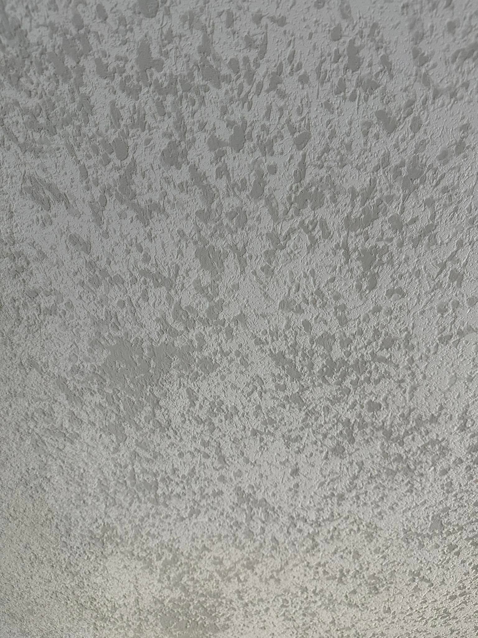 Gray textured surface with a mottled, grainy pattern