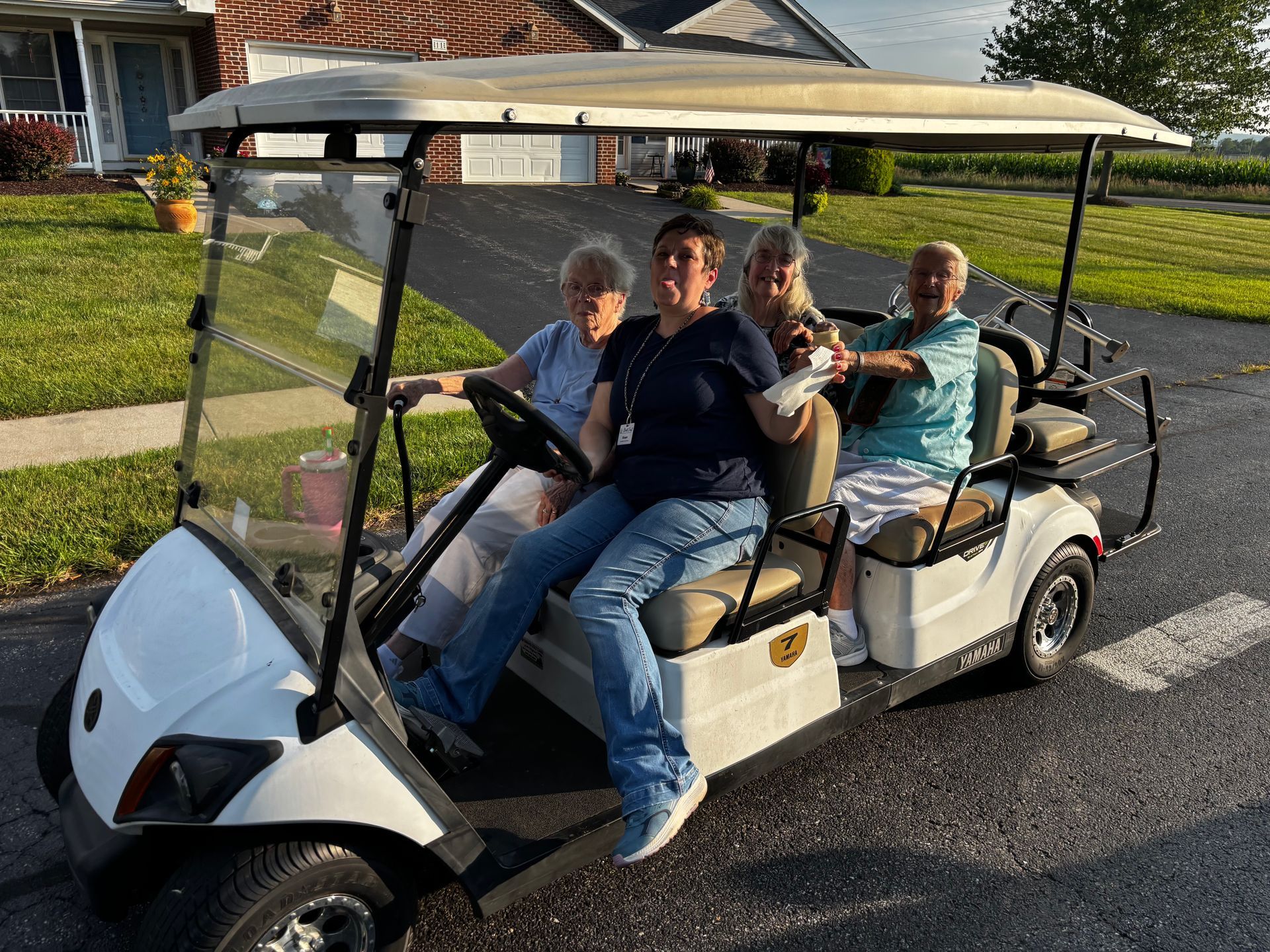 Residents being shown around the community in the shuttle cart