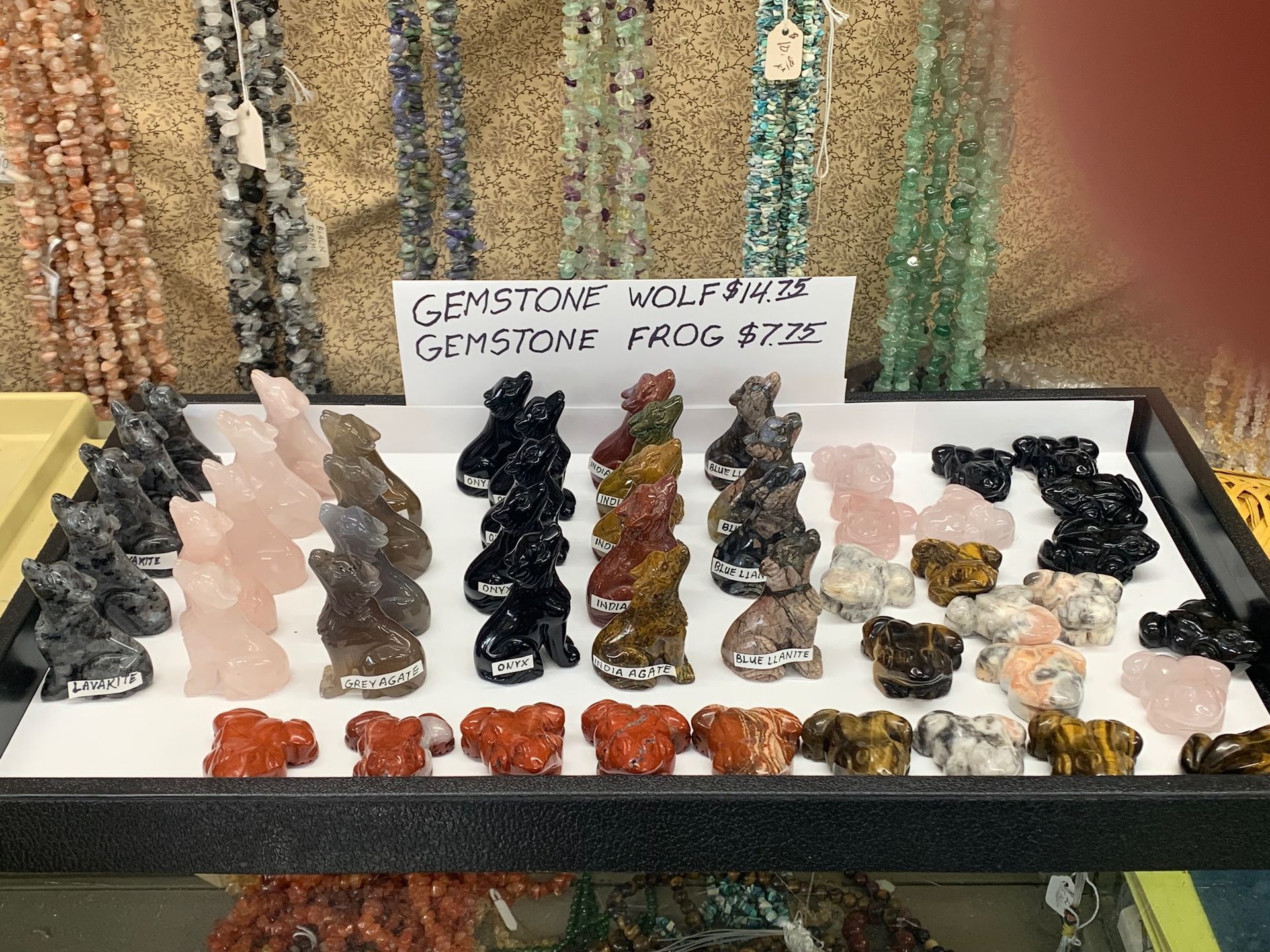 A display case filled with various types of rocks and stones.